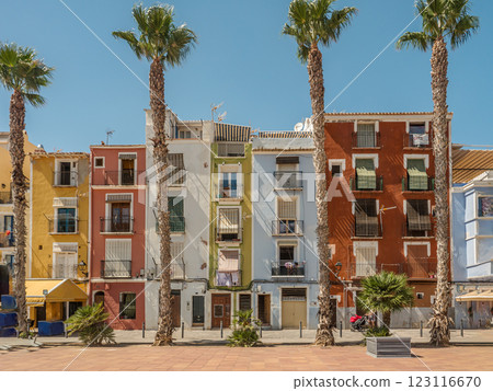 Colorful Mediterranean Houses With Palm Trees Under Clear Blue Sky 123116670