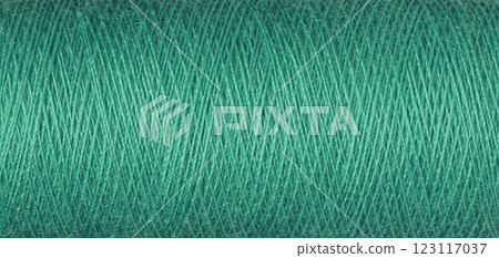 macro texture of a skein of green sewing thread macro texture of a skein of green sewing thread 123117037