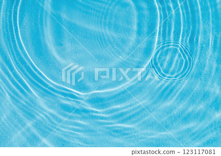 drops on water with circles on a blue background drops on water with circles on a blue background 123117081