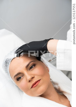 Woman receiving facial treatment at a skincare clinic during the afternoon 123117551