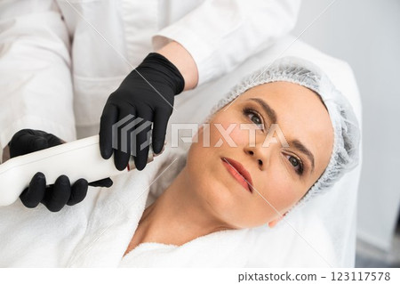Woman receiving skincare treatment in a professional salon during daytime 123117578