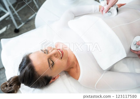 Woman receiving a therapeutic treatment in a wellness center 123117580