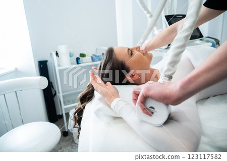 Woman undergoing a relaxing treatment in a modern wellness center 123117582