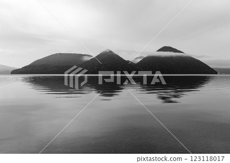 Cloud-covered mountains reflected in Lake Toya Cloud-covered mountains reflected in Lake Toya 123118017