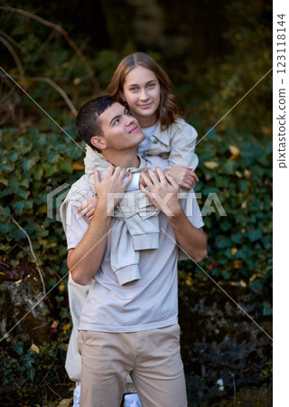 Embracing Teen Love in the Greenery of the Park. 123118144