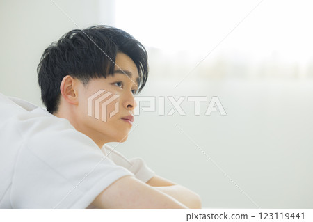 A young man holding a cheek A young man holding a cheek 123119441
