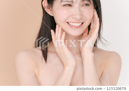 A woman satisfied with her skin care A woman satisfied with her skin care 123120679