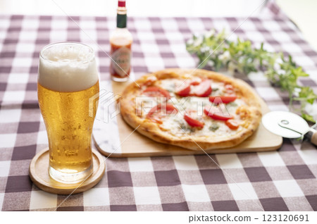Delicious pizza and beer Delicious pizza and beer 123120691