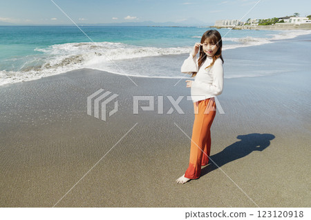 Woman enjoying the beach Woman enjoying the beach 123120918