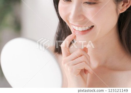 Woman smiling with beautiful teeth Woman smiling with beautiful teeth 123121149
