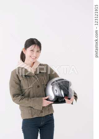Female rider with helmet Female rider with helmet 123121915