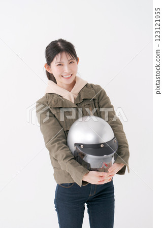 Female rider with helmet 123121955