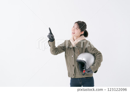 Female rider with helmet 123122096