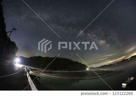 The summer Milky Way flows through the Setouchi Sea, lined with oyster racks 123122260