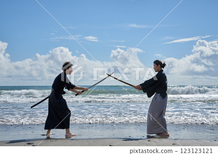 Two samurai facing off on the beach 123123121