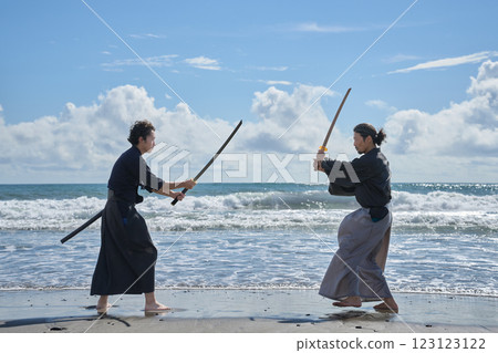 Two samurai facing off on the beach 123123122