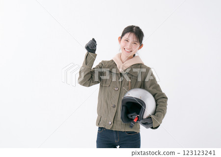 Female rider doing a fist pump 123123241