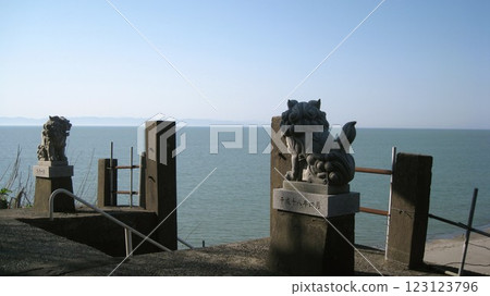 A guardian lion overlooking the Sea of Japan and Sado Island A guardian lion overlooking the Sea of Japan and Sado Island 123123796