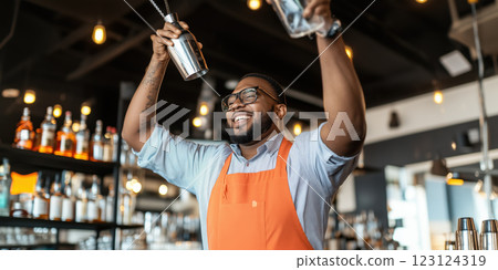 Juggling bartender skillfully tossing cocktail shaker with joy 123124319