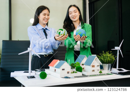Business team people planning hand using laptop for working technology and business Net zero 123124786