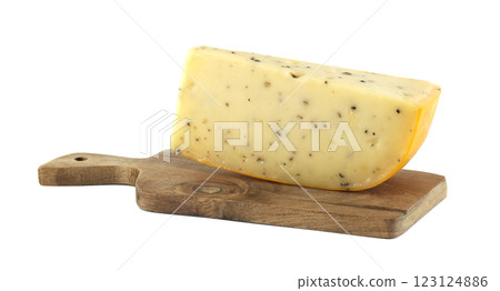 Piece of cheese with herbs resting on wooden cutting board Piece of cheese with herbs resting on wooden cutting board 123124886
