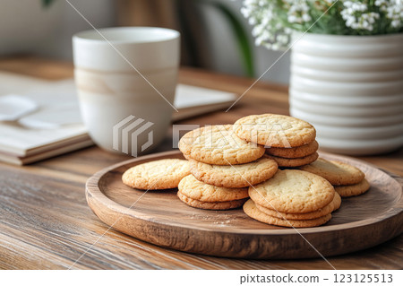 Tray with homemade cookies and cup of tea on the kitchen table in the morning. Home comfort. Generated by artificial intelligence 123125513