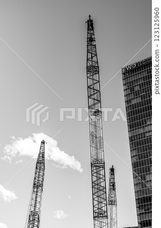Construction cranes line the streets of Yaesu, Tokyo 2025.02 a-5 monochrome 123125960