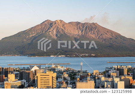Sakurajima as seen in the setting sun from the observation deck at Shiroyama Park in Kagoshima City, Kagoshima Prefecture 123125998