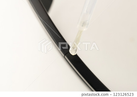 Repairing a broken eyeglass frame with glue Repairing a broken eyeglass frame with glue 123126523