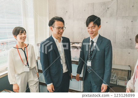 Colleagues working at the same company 123126899