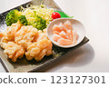 Pearl oyster scallop tempura and sashimi 123127301
