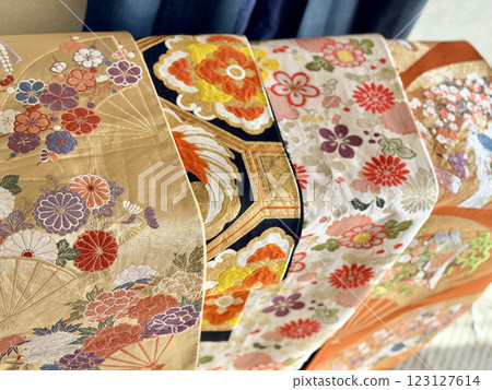 Four gorgeous obi strips lined up 123127614