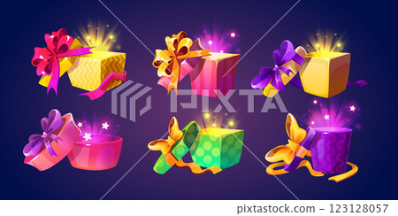 Open gift boxes set with glowing magical light Open gift boxes set with glowing magical light 123128057