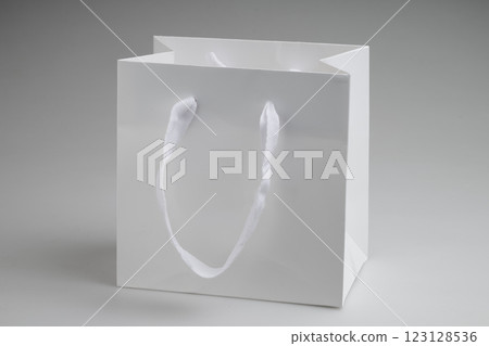 Clean white luxury paper bag in studio light on white background Clean white luxury paper bag in studio light on white background 123128536