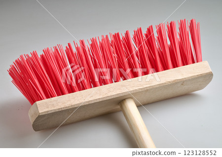 Clean Red street broom in studio light on white background Clean Red street broom in studio light on white background 123128552