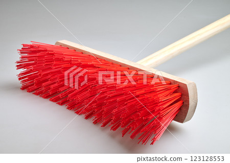 Clean Red street broom in studio light on white background Clean Red street broom in studio light on white background 123128553
