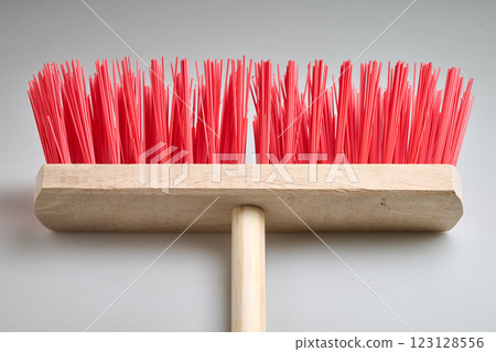 Clean Red street broom in studio light on white background 123128556