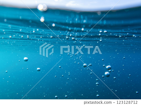 Bubbles rising in refreshing blue water (AI-generated image) Bubbles rising in refreshing blue water (AI-generated image) 123128712