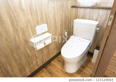 A toilet with a sophisticated design and a heated toilet seat 123129083