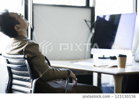 A tired businessman A tired businessman 123130156