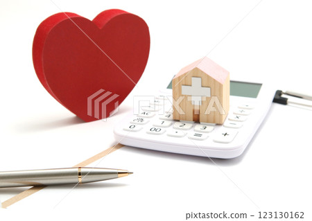 Image of medical expenses and health: calculator and miniature hospital 123130162