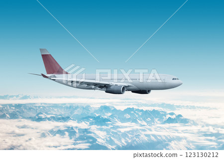 Wide body passenger airplane flying in the air over mountains 123130212