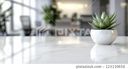 Cosy office: spacious layout, bright lighting, green accents, calming atmosphere, blank text space, modern decor, tranquil environment, natural elements, creative workspace, minimalist design. 123130650