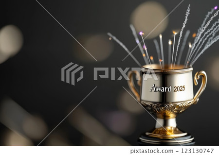Engraved trophy: award inscription, 2025 year, golden prize, victory token, polished accolade, recognition object, metallic honor, text engraving, ceremonial tribute, achievement symbol. 123130747