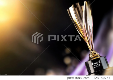 Golden trophy: engraved award, 2025 date, shiny prize, recognition object, metallic accolade, victory symbol, engraved text, year inscription, polished achievement, ceremonial distinction. 123130765