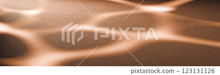 Soft golden sand with abstract light reflections, wave patterns natural background or product placement in warm earthy tones for design and advertising project Soft golden sand with abstract light reflections, wave patterns natural background or product placement in warm earthy tones for design and advertising project 123131126