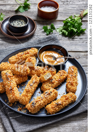 panko breaded tofu sticks with peanut butter sauce 123131162