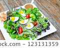 Boiled eggs with vegetables. Salad for diet food 123131359