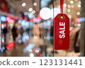 Red sale tag on store window during shopping season 123131441