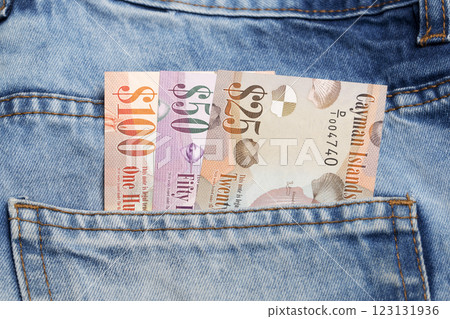 Cayman Islands dollar in the pocket of blue jeans Cayman Islands dollar in the pocket of blue jeans 123131936
